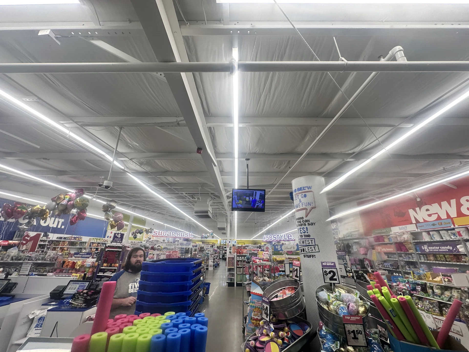 Linear ceiling lighting across a commercial retail interior